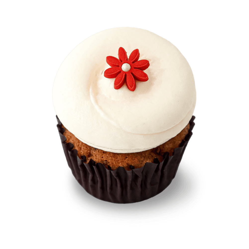 Vegan carrot cupcake with cream cheese frosting and red flower
